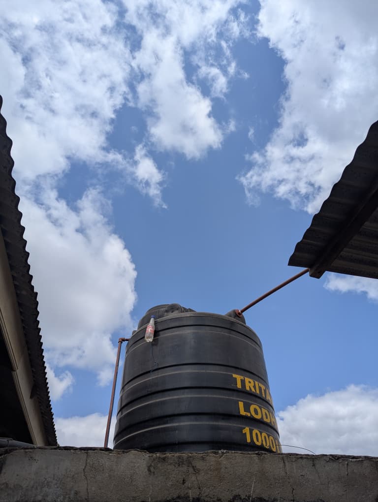 The first-stage storage tank installed and connected to the well